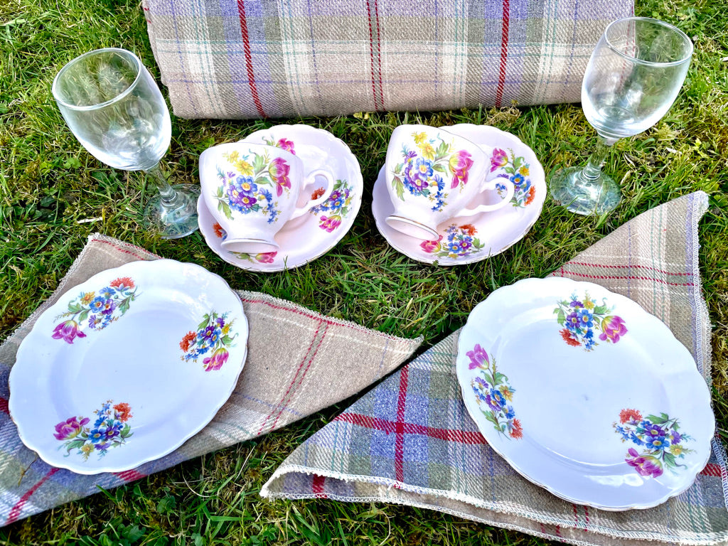 vintage tea plates in picnic bsket